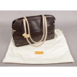 A Radley London brown leather hand bag, with dust bag. Wear on base of bag.