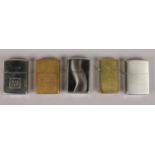 Five Zippo lighters. Including Silk cut, Budweiser, brass examples, etc.