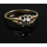 An 18ct gold and diamond ring. Size N. 2.13g. Approximately 0.25 carat diamond.