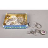 A tin of Silver jewellery. To include four bangles, six rings and numerous chains etc. (260g total)