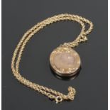 A 9ct gold front and back mourning locket on 9ct gold chain. 9.44g gross weight.