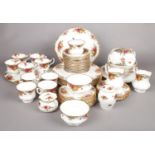 A quantity of Royal Albert tea and dinnerwares in the Old Country Roses design. Including cups,