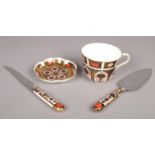 Four pieces of Royal Crown Derby Imari pattern ceramics. Including teacup, trinket dish, knife, etc.