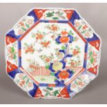 A large Japanese Meiji period octagonal charger with floral decoration. 43cm.
