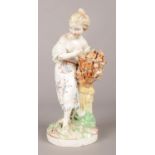 An 18th century Derby porcelain figure, modelled as a maiden with wheatsheaf. 21.5cm. Some missing