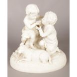 A Victorian parian figure group, Christ and St John. 26.5cm. Crack through base. Chip to left hand