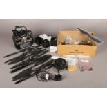 A box containing assorted parts for drones. To include two motors (7-Motors no MN3508), propeller