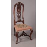 A late 17th/early 18th century carved walnut side chair in the manner of Daniel Marot.