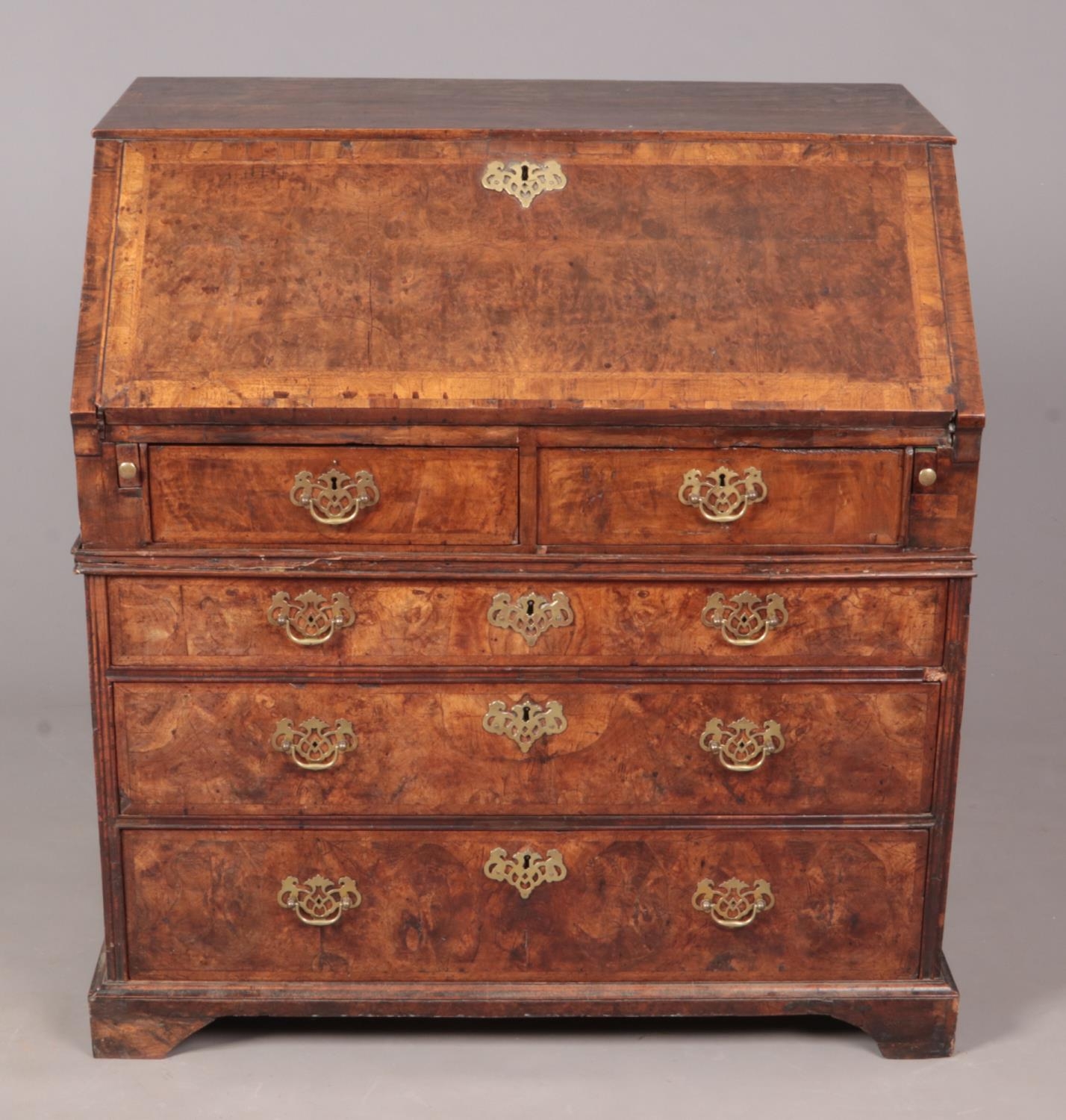 An early Georgian figured walnut bureau with fitted interior. 98cm x 92.5cm x 60.5cm.