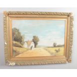 A E Morris, a large gilt frame oil, rural landscape scene with farm building and a figure on horse