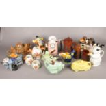 Two boxes of assorted ceramics. To include ten novelty teapots, three Langley graduated jugs and a