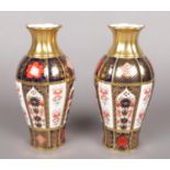 A pair of Royal Crown Derby baluster shaped vases in the Old Imari pattern. (19cm high) Good