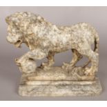 A veined marble sculpture of a lion with a ball at its feet. Height 25.5cm, Width 13cm, Length 29cm.