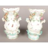A pair of 18th century Derby porcelain vases with pierced necks and decorated with insects and
