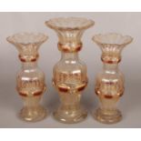 A garniture of early Bohemian clear glass vases. With gilt and cranberry flash decoration. Tallest