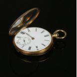 An 18ct gold fob watch. With enamel dial, Roman numeral markers and subsidiary seconds. Movement