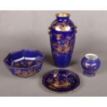 Four pieces of blue ground Cauldon pottery. With gilt chinoiserie decoration. Including large