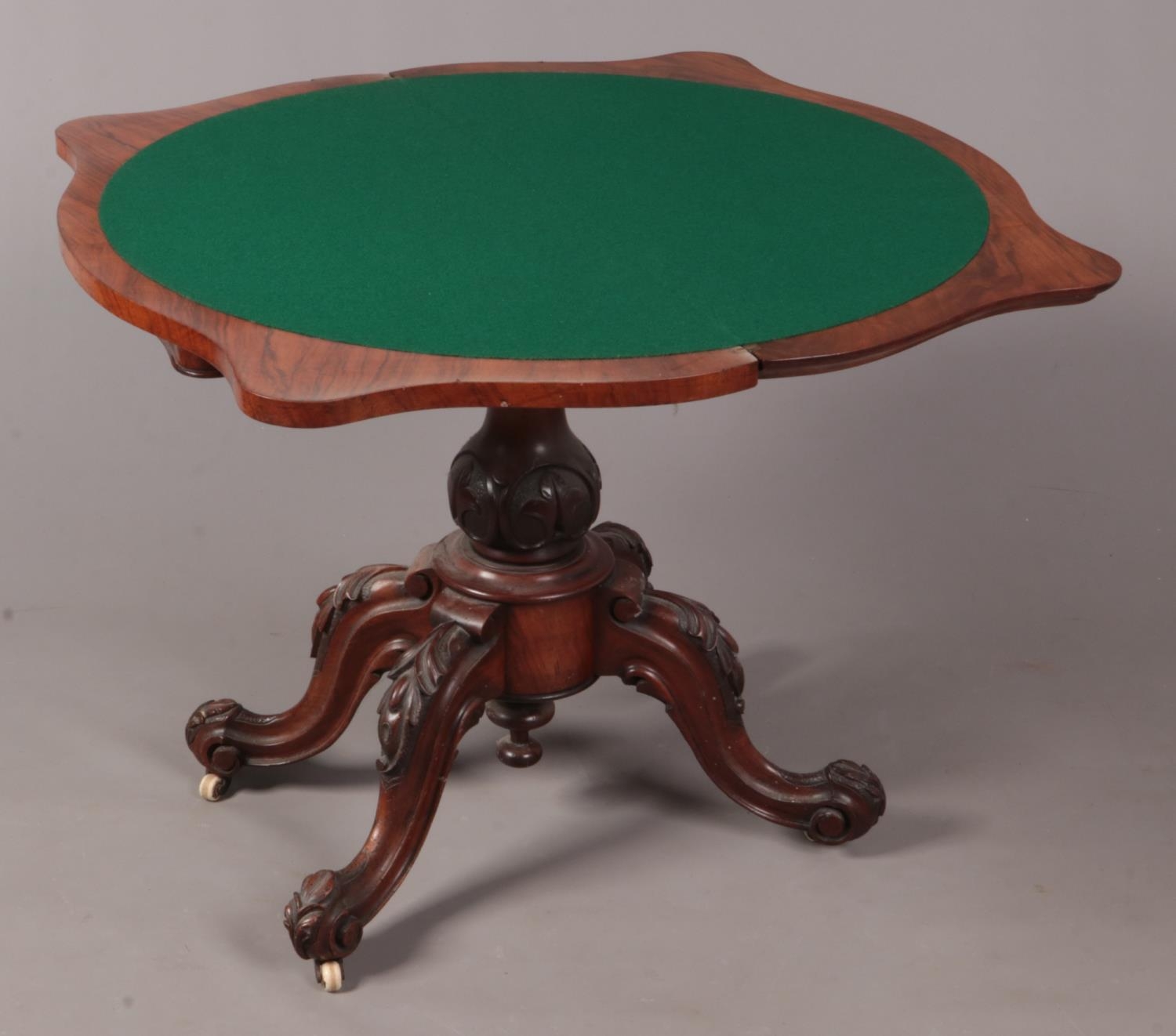 A Regency carved mahogany and figured walnut fold over games table. - Bild 2 aus 2