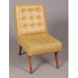 An olive leather retro shallow-buttoned chair with studs to the rear.