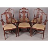 A set of six G.T. Rackstraw (of Worcester) mahogany shield-back dining chairs, two of which are