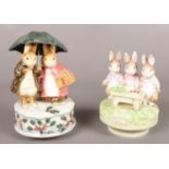 Two boxed Beatrix Potter ceramic musical figure groups. Including Two Rabbits Under a Umbrella