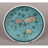 An antique Japanese dish. Decorated with blossom and butterfly. Eight character marks to base.