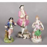 Three 19th century Continental porcelain figures, in the style of Samson, Chelsea and Derby.