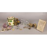 A box of assorted collectables. To include a silver old mother hubbard charm, a selection of