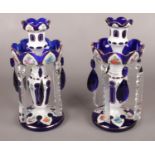 A pair of Bohemian blue and white overlaid glass lustres with floral decoration. Detachable nozzles.