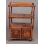 A Victorian carved bur walnut three tier Canterbury whatnot stand of delicate form, strung in