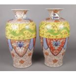 A large pair of Japanese Meiji period baluster shaped vases. Imari style with dragon decoration.
