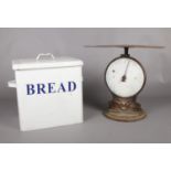 A vintage enamel bread bin & salter weighing scales.