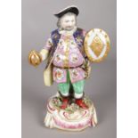 A 19th century Derby style figure modelled as Falstaff raised on rococo style base. 22cm. Lacking