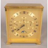 A contemporary brass Looping mantel clock. With day, date and month subsidiary dials and moon