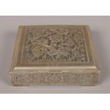 A small square Persian/Iranian silver cigarette box. Decorated with birds and flowers. Stamped