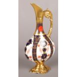 A Royal Crown Derby 1128 pattern Imari, swan neck ewer. (26cm tall) Slight knock to the gilt on