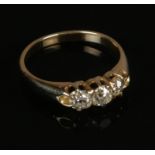 A Victorian 18ct gold three stone diamond ring. Size N 1/2. 3.17g.