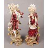 A pair of continental figures in classical dress. 28cm. Some damage and repairs mostly to the lady.