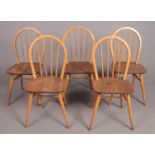A set of five Ercol style elm spindle back dining chairs. British Standard Kitemark stamped on the