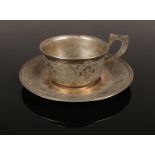 A small Persian/Iranian silver cup and saucer. Stamped 84. Diameter of saucer 9cm. 88g.