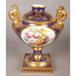 A 19th century Derby urn with hand painted panel of North Wales and floral panel to reverse.