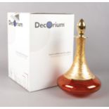 A boxed red & gold glass Decorium decanter. H: 30.5cm.