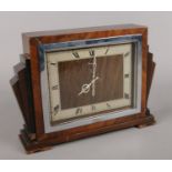 A Genalex walnut cased art deco mantel clock.