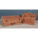 Two wicker picnic baskets. No contents.