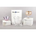 Three boxed Decorium glass pieces. To include a 24ct gold decorated bowl, a large elipse bowl/vase &