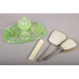 A uranium glass bedroom set along with a dressing table set (mirror, brush, comb).