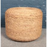 A large wicker pouffe. height 47cm diameter 58cm.