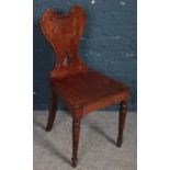 A Victorian carved mahogany hall chair.