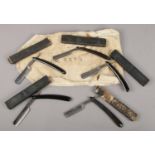 A roll of five vintage boxed cut throat razors. Includes Wald, John Blyde etc.