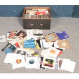 A box of single records. Including Queen, Rolling Stones, Madness, U2, Motown, ABBA, etc.